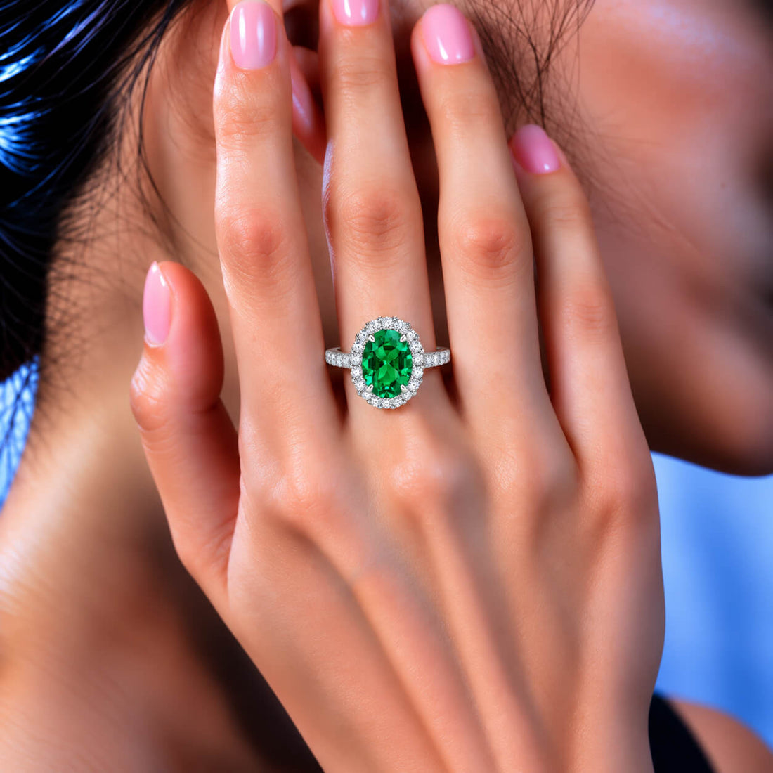 Halo setting oval cut lab grown emerald engagement ring