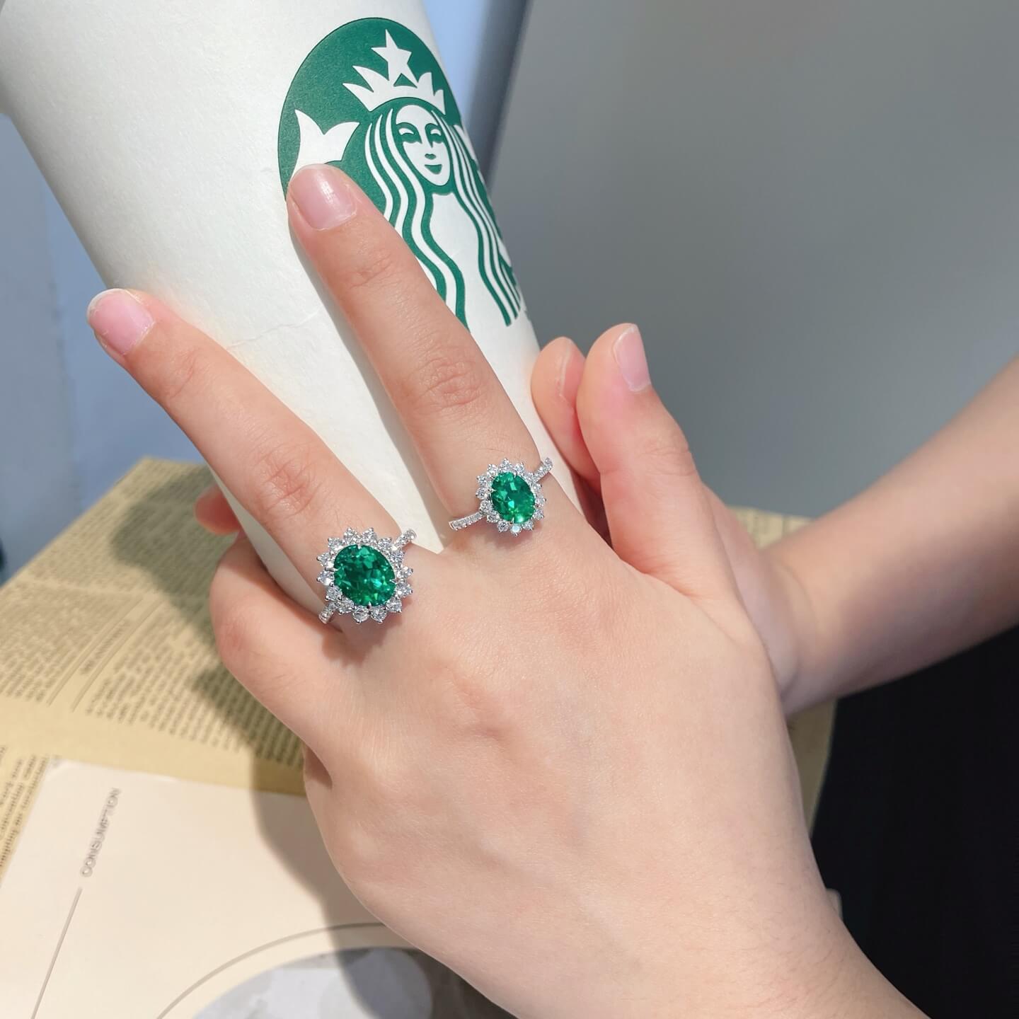 Halo setting oval cut lab grown emerald engagement ring