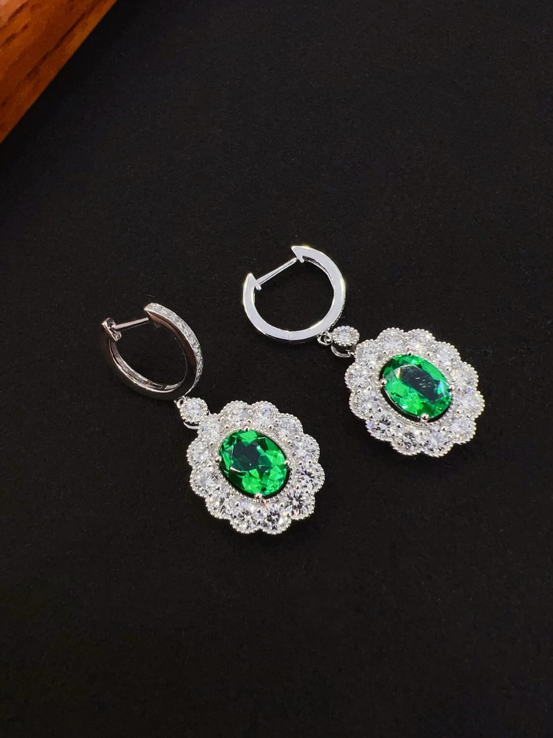 Halo setting oval cut lab grown emerald hoop earrings