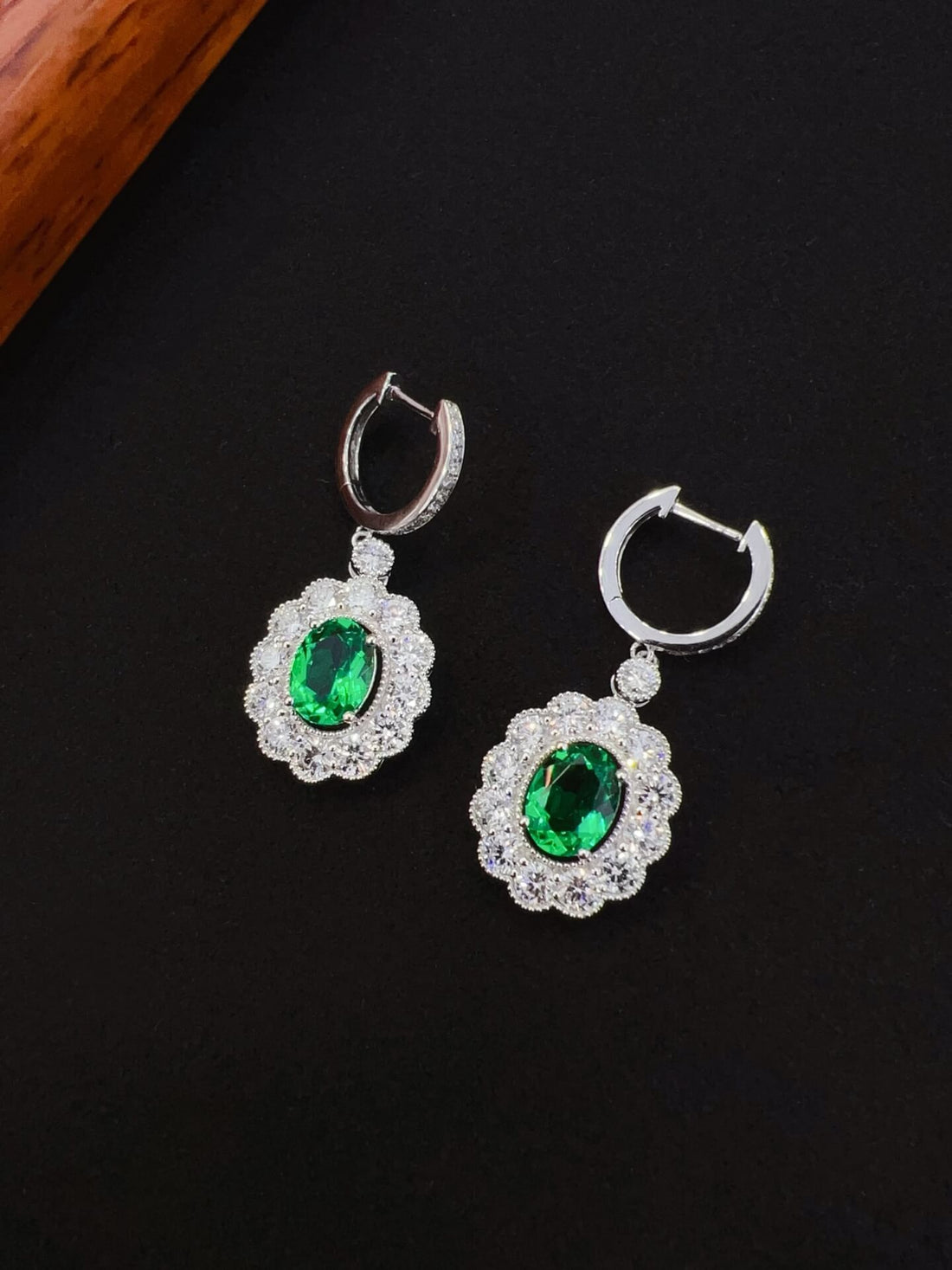 Halo setting oval cut lab grown emerald hoop earrings