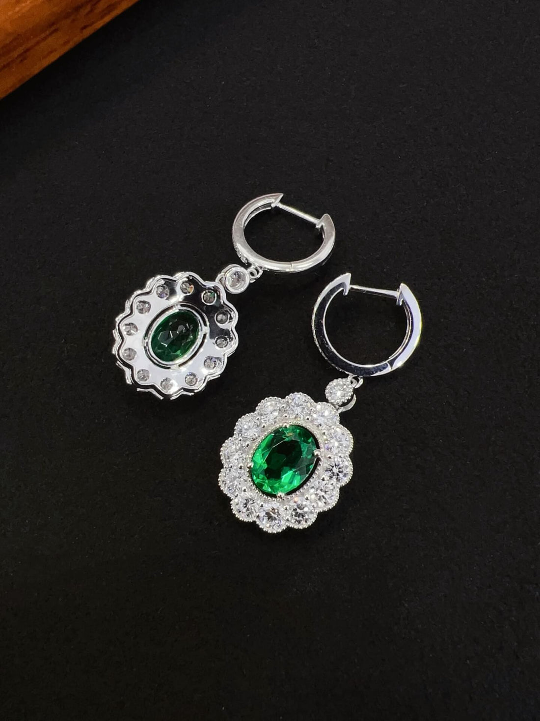 Halo setting oval cut lab grown emerald hoop earrings