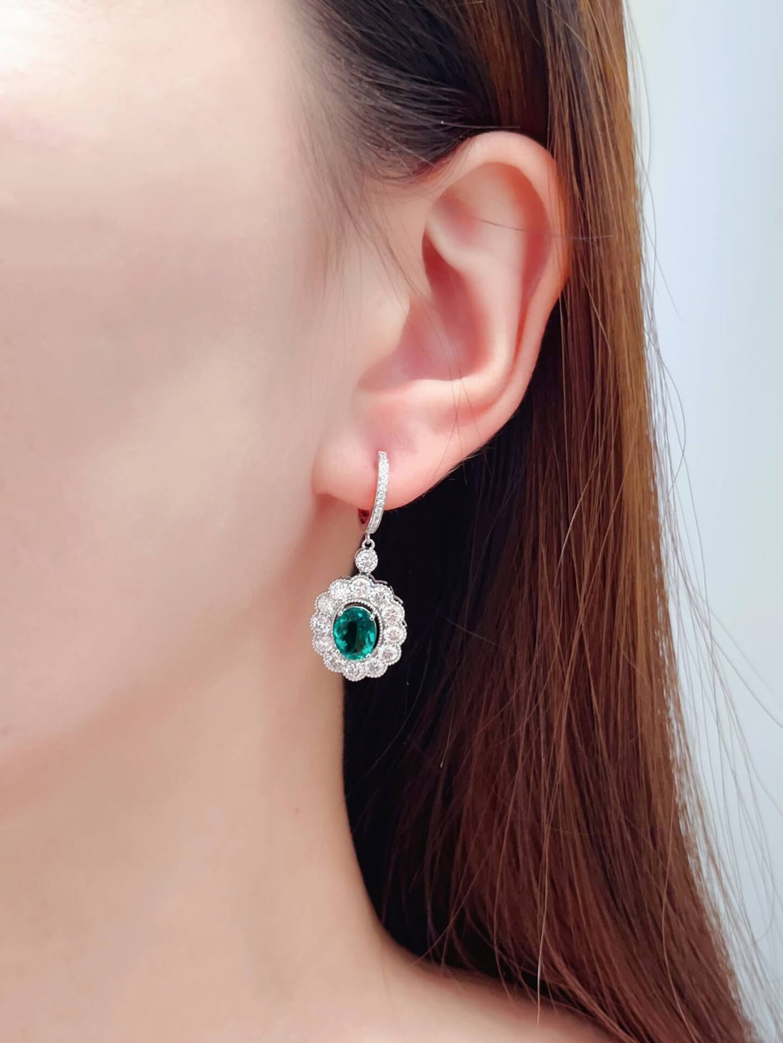 Halo setting oval cut lab grown emerald hoop earrings