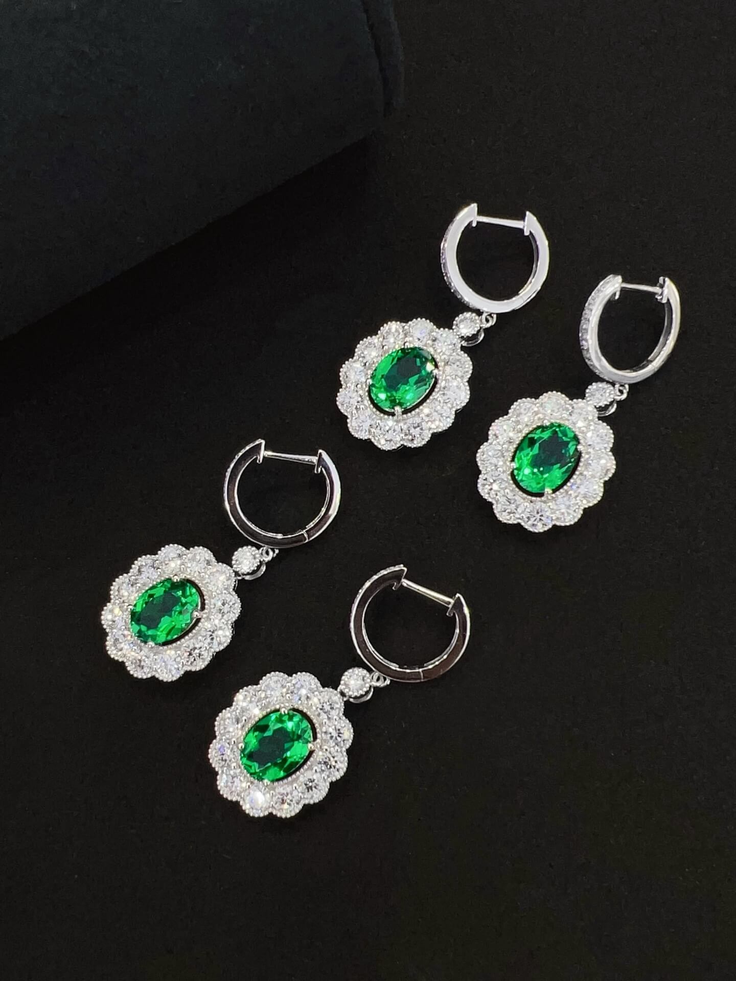Halo setting oval cut lab grown emerald hoop earrings