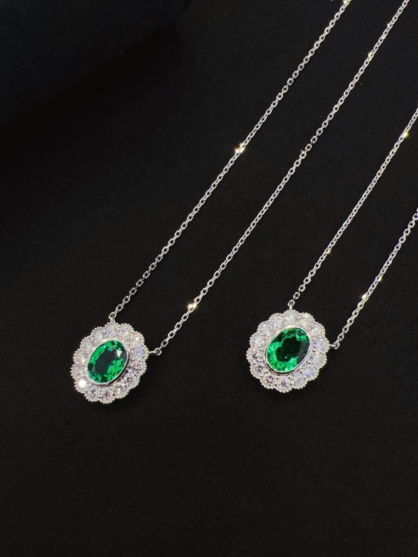 Halo setting oval cut lab grown emerald pendant necklace