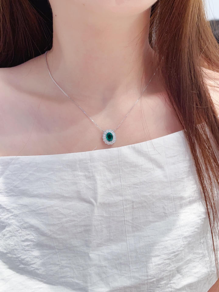 Halo setting oval cut lab grown emerald pendant necklace