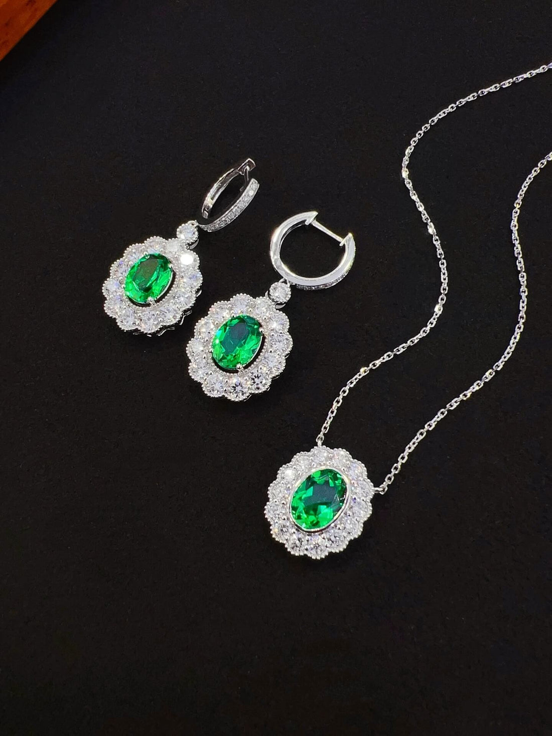 Halo setting oval cut lab grown emerald pendant necklace
