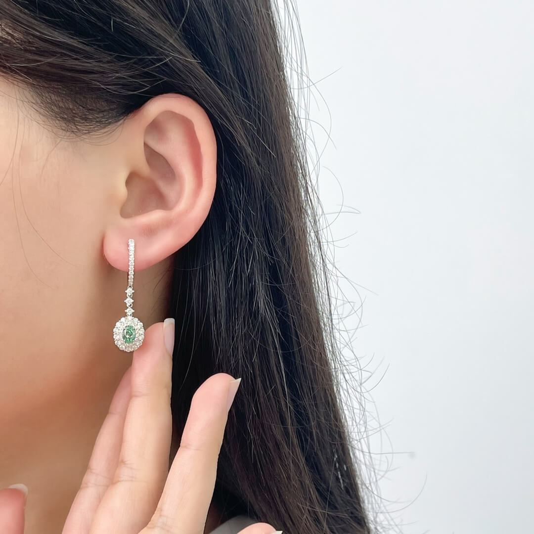 Halo setting oval cut lab grown green diamond hoop earrings