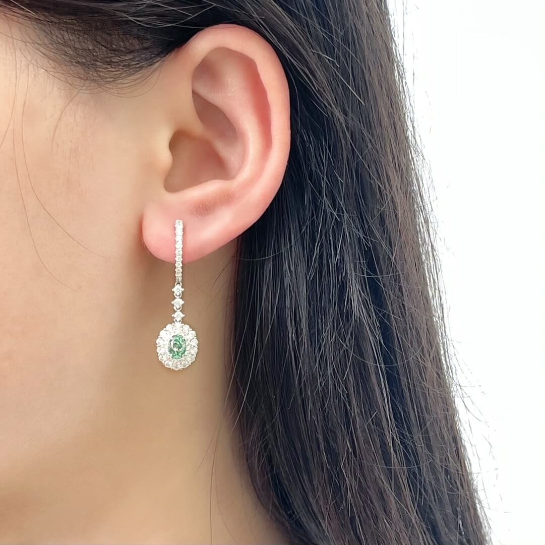 Halo setting oval cut lab grown green diamond hoop earrings