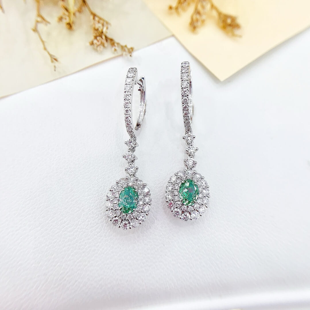 Halo setting oval cut lab grown green diamond hoop earrings