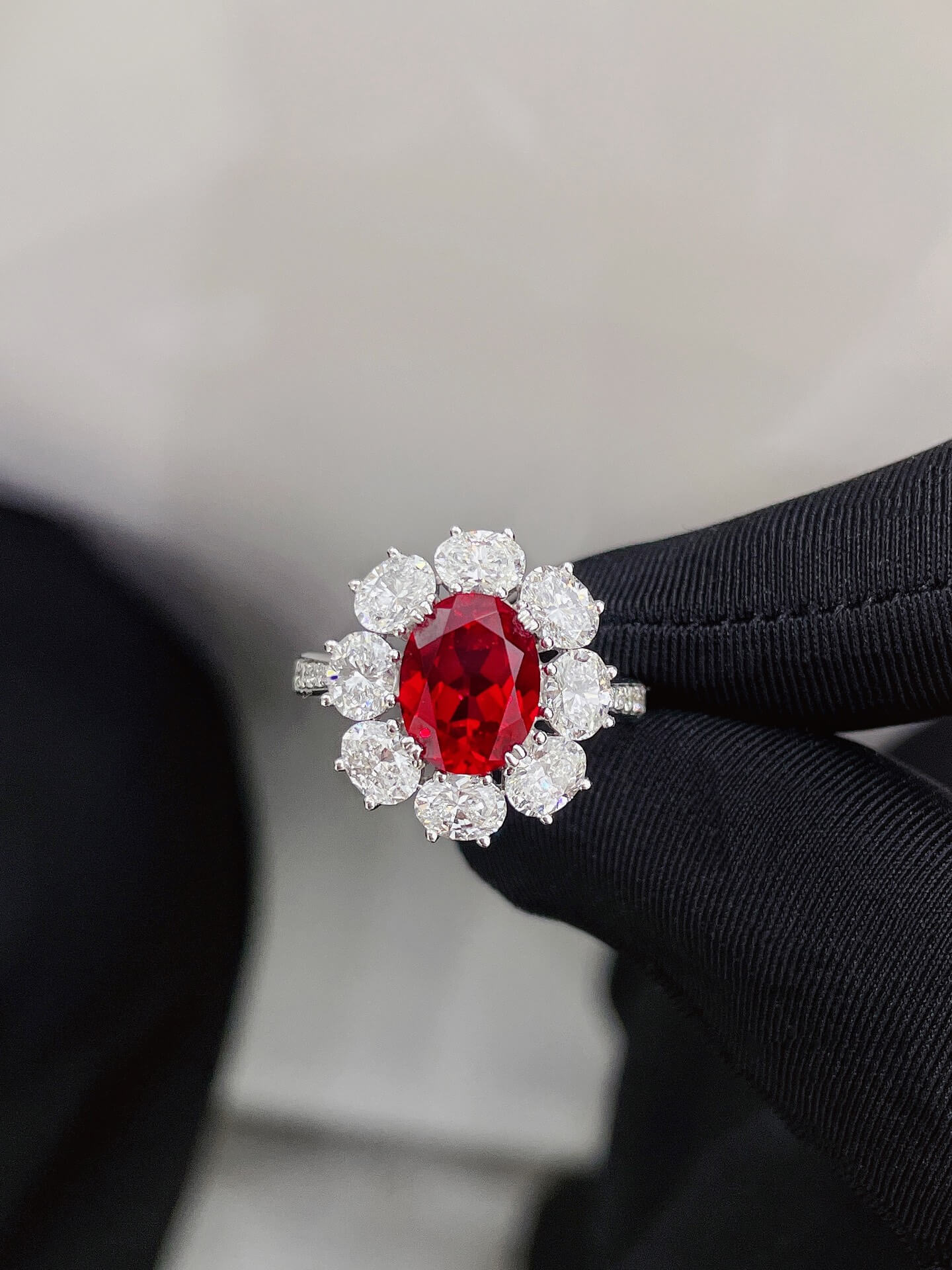 Halo setting oval cut lab grown ruby engagement ring