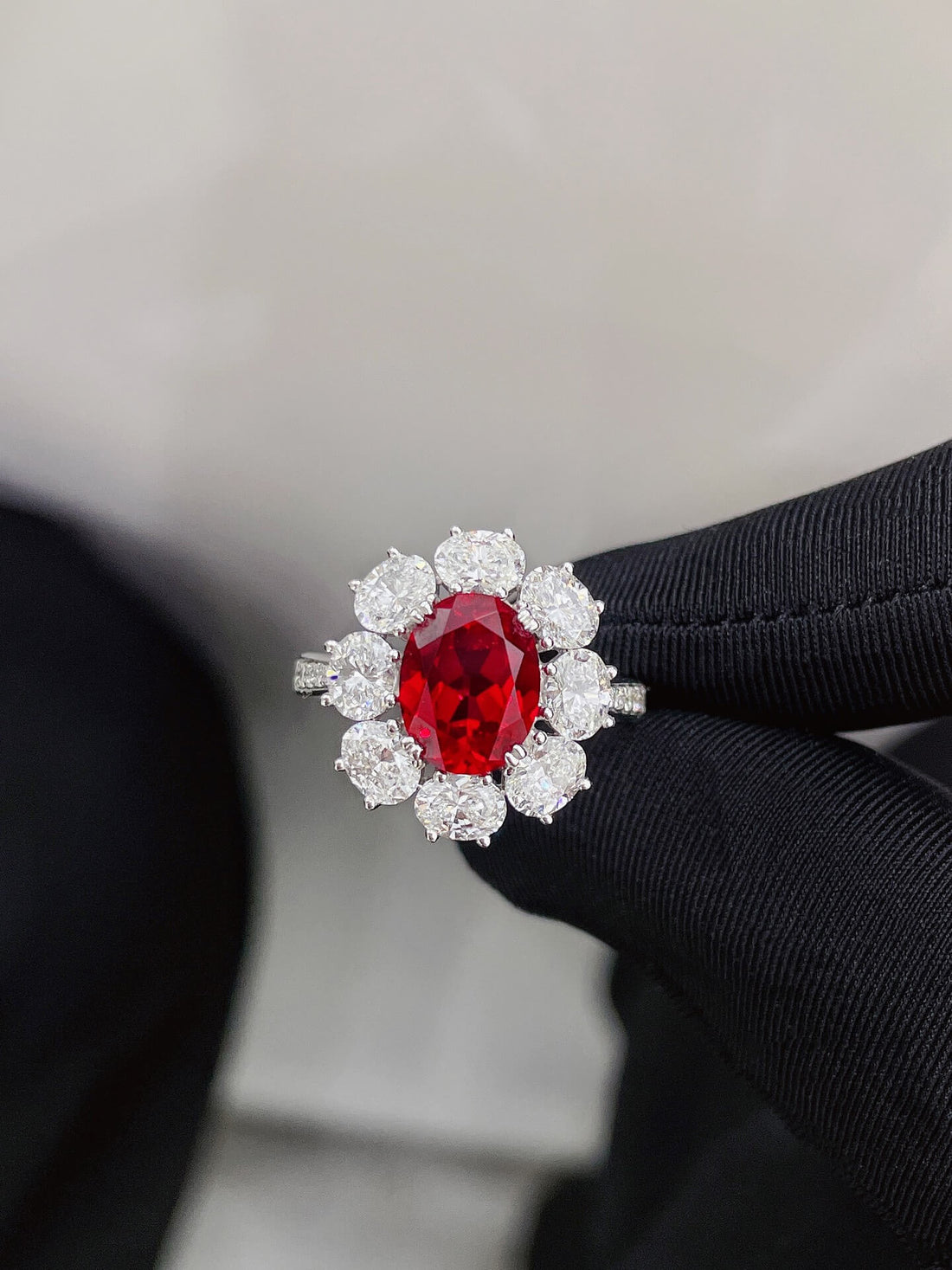 Halo setting oval cut lab grown ruby engagement ring