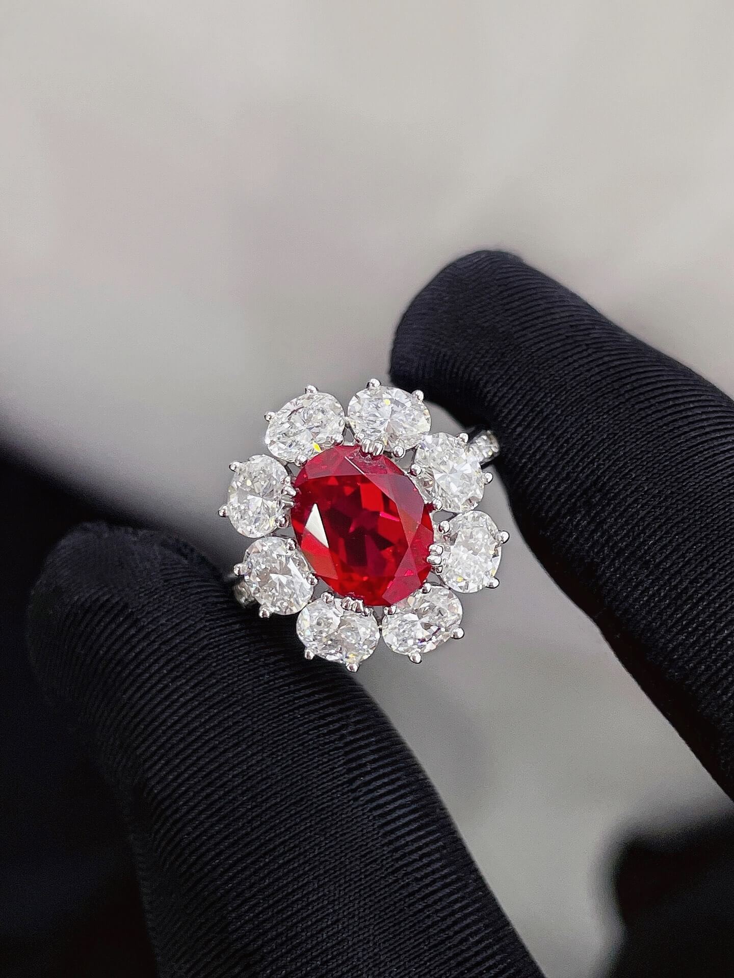 Halo setting oval cut lab grown ruby engagement ring
