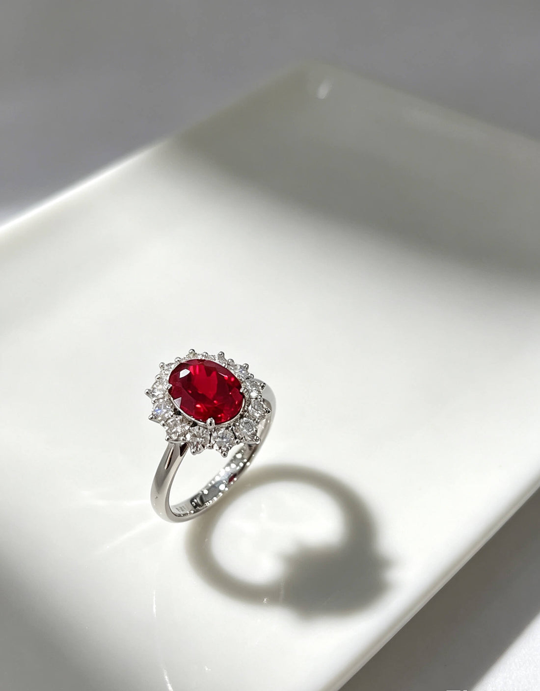 Halo setting oval cut lab grown ruby engagement ring