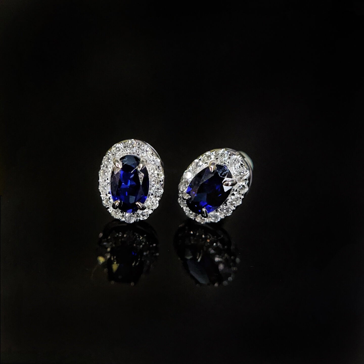 Halo setting oval cut lab grown sapphire earrings stud