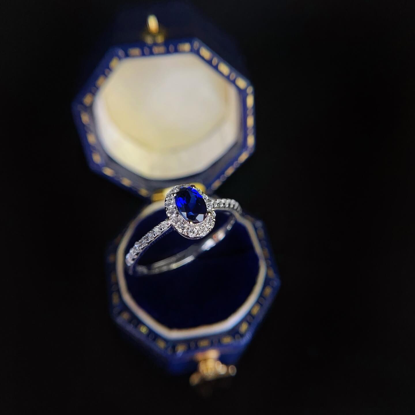Halo setting oval cut  lab grown sapphire engagement ring