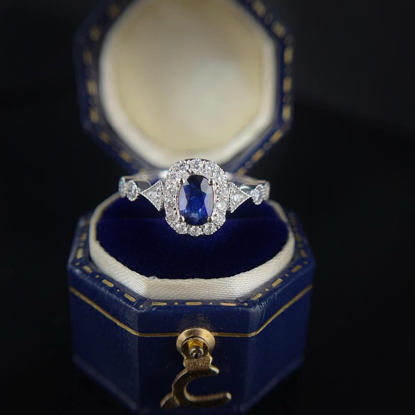 Halo setting oval cut  lab grown sapphire engagement ring