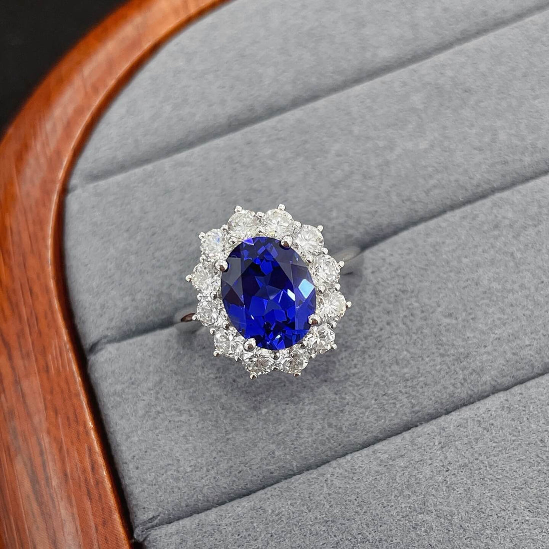 Halo setting oval cut  lab grown sapphire engagement ring