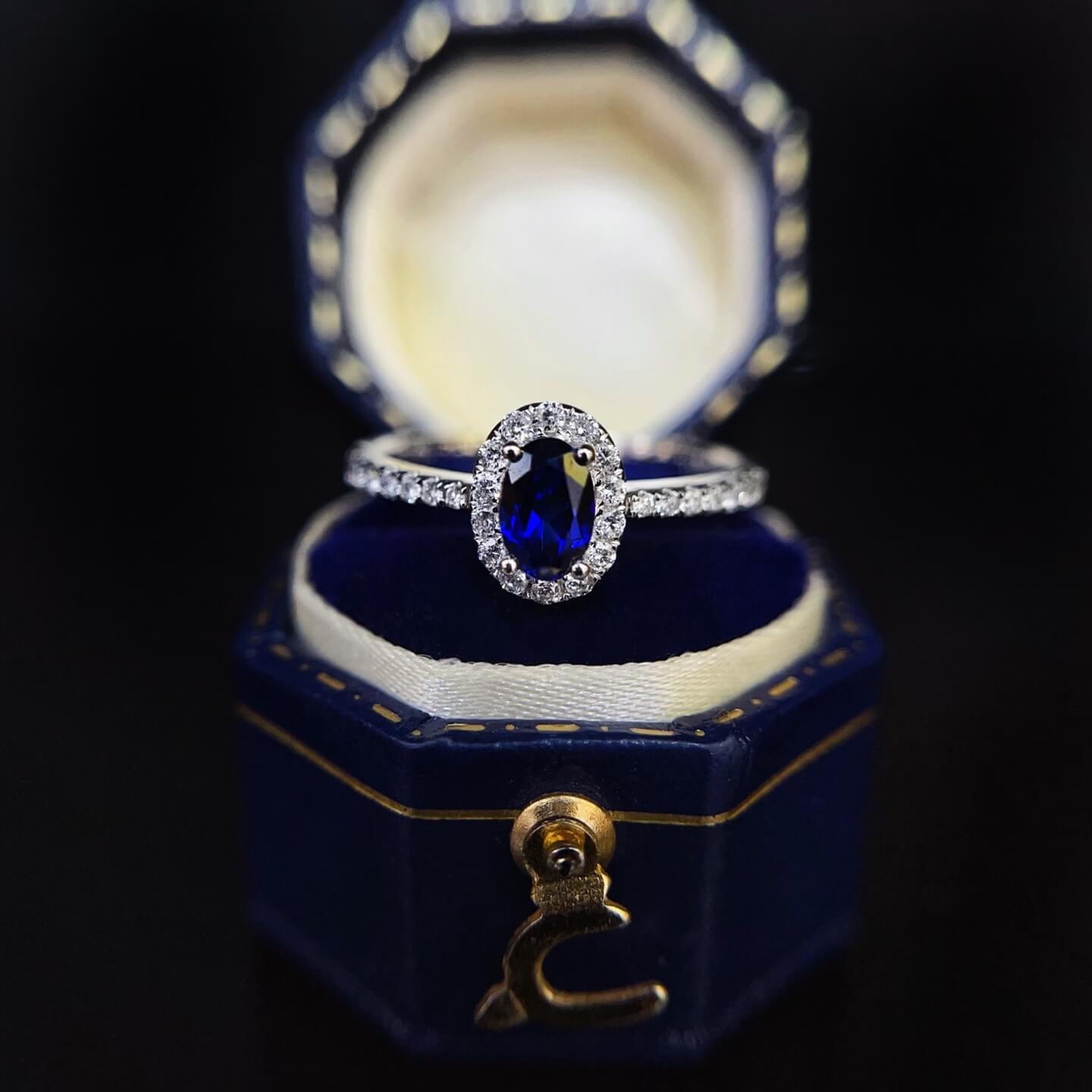 Halo setting oval cut  lab grown sapphire engagement ring
