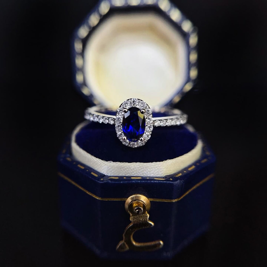 Halo setting oval cut  lab grown sapphire engagement ring