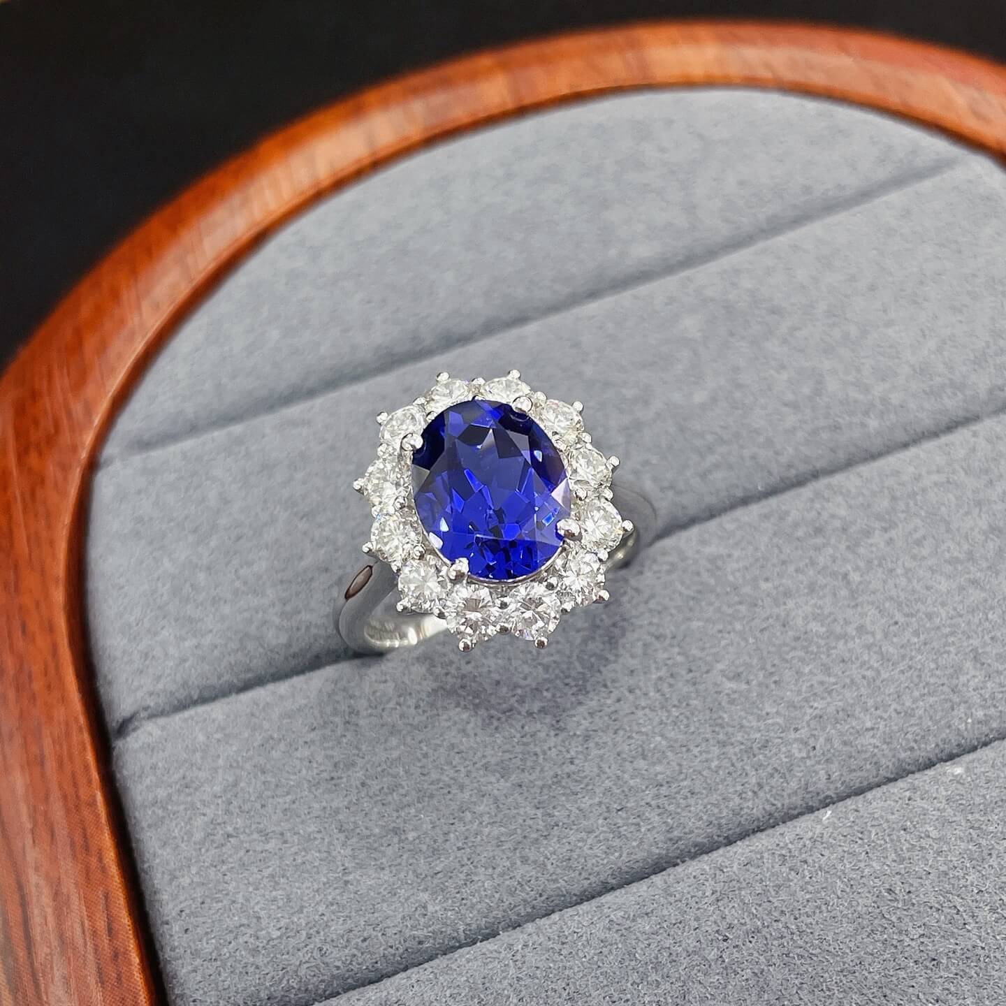 Halo setting oval cut  lab grown sapphire engagement ring