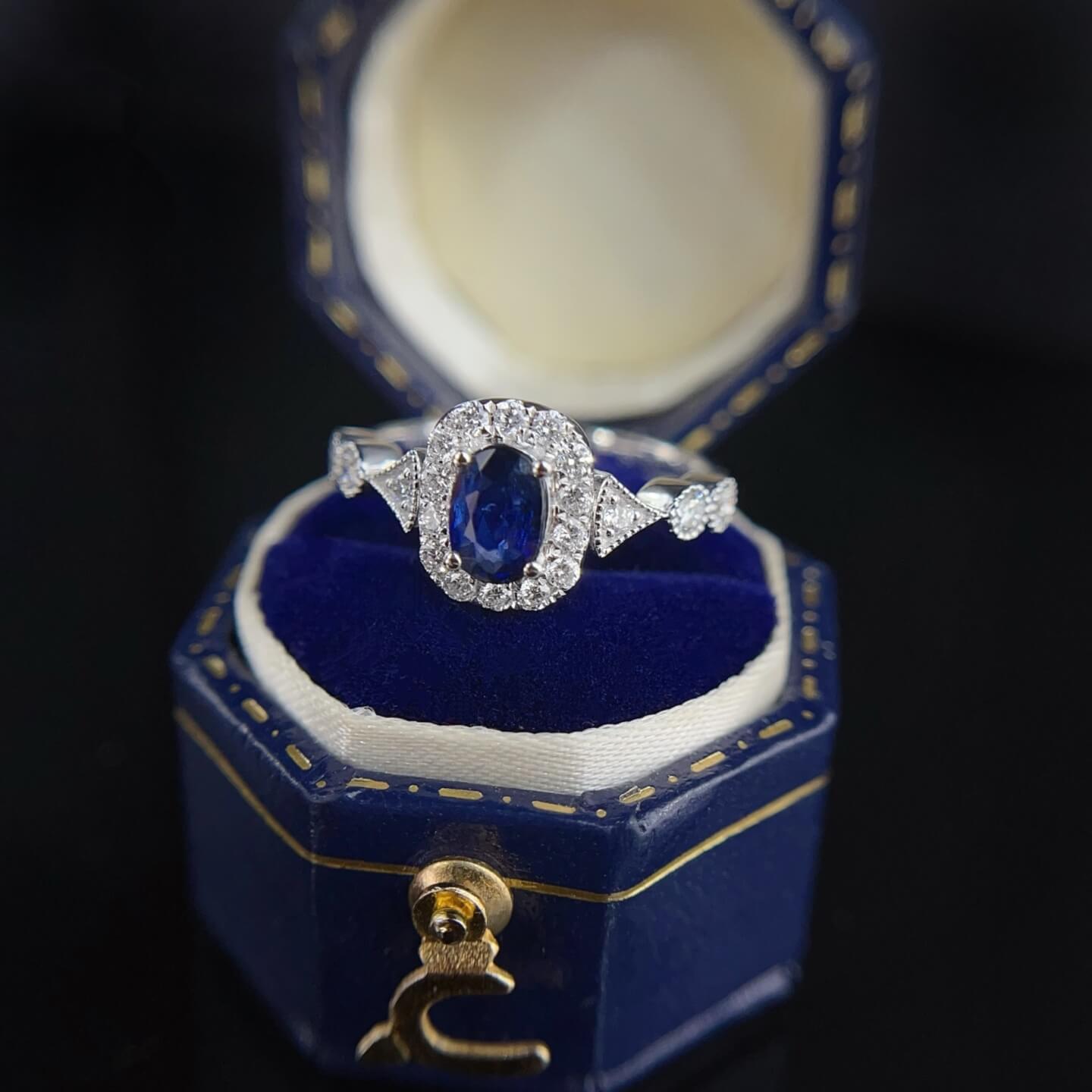 Halo setting oval cut  lab grown sapphire engagement ring