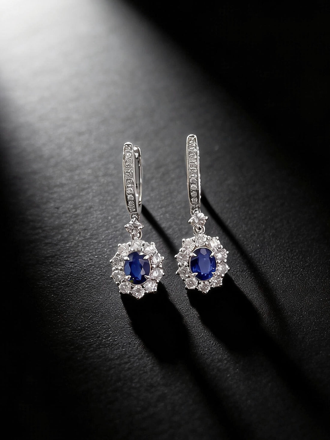 Halo setting oval cut lab grown sapphire hoop earrings