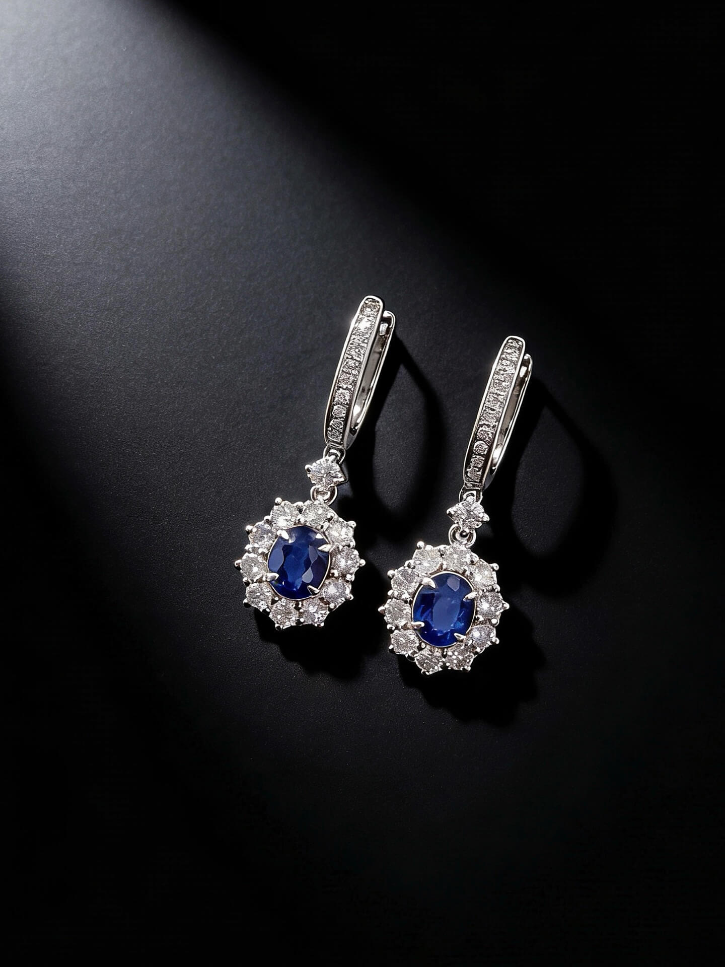 Halo setting oval cut lab grown sapphire hoop earrings