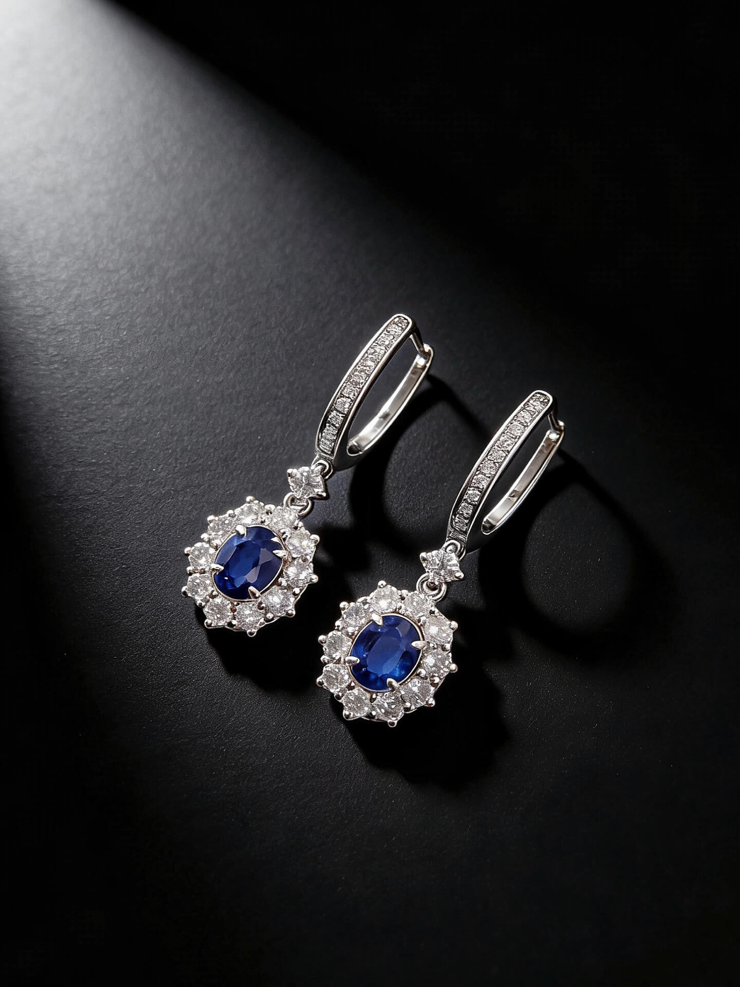 Halo setting oval cut lab grown sapphire hoop earrings