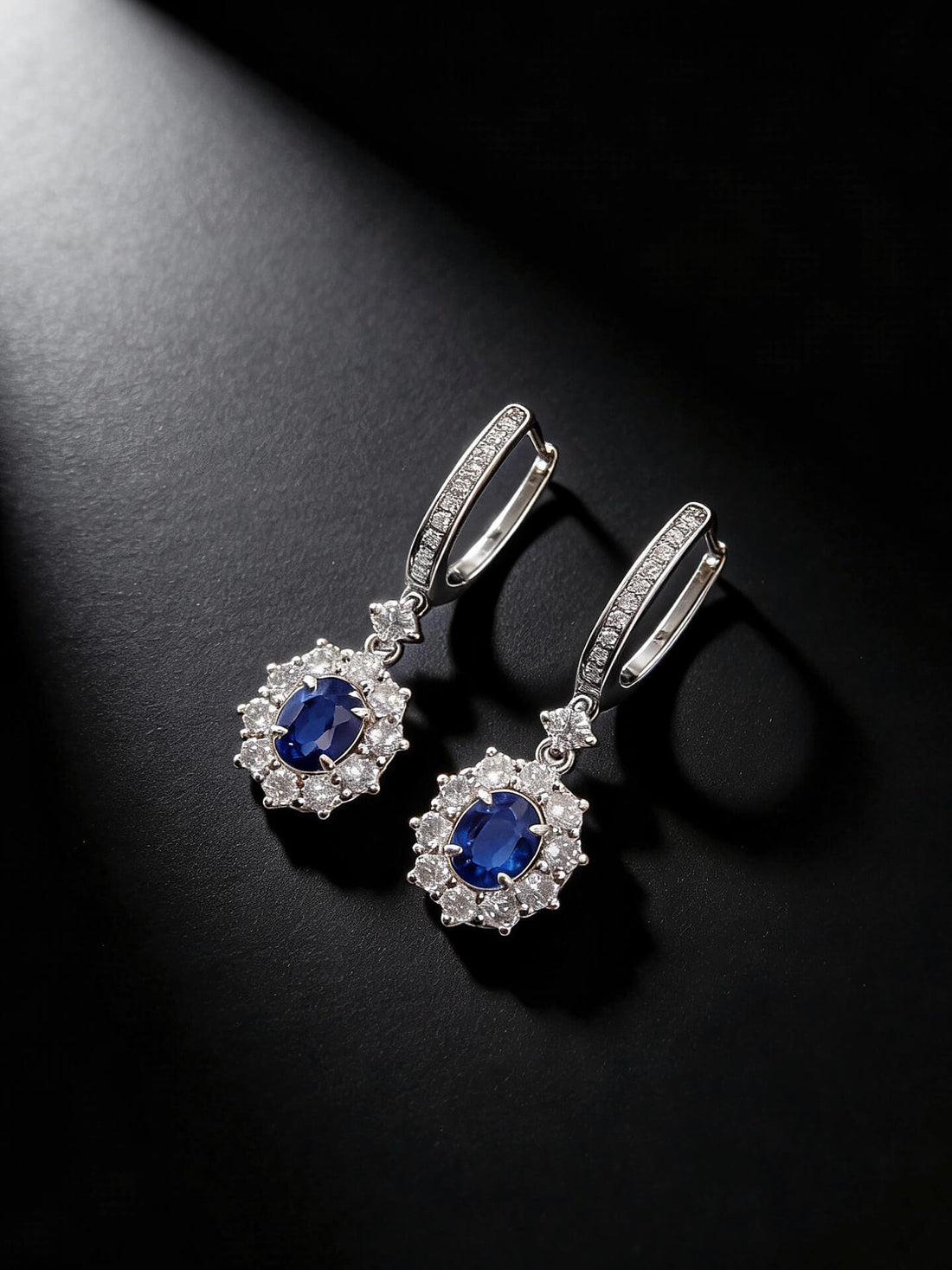 Halo setting oval cut lab grown sapphire hoop earrings