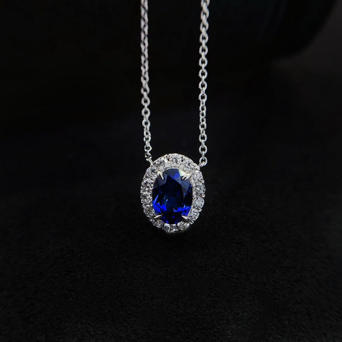 Halo setting oval cut lab grown sapphire pendant necklace