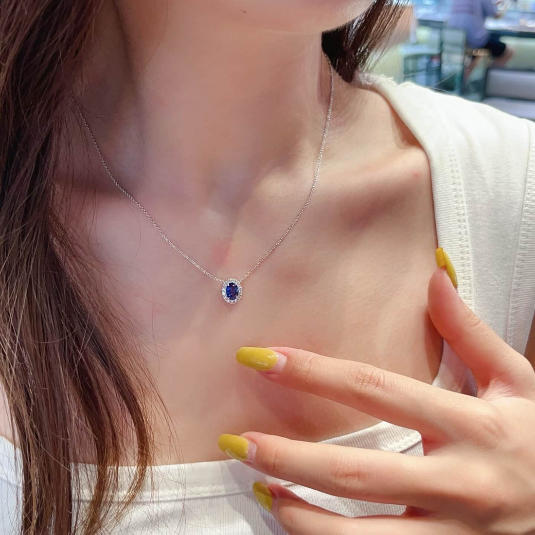 Halo setting oval cut lab grown sapphire pendant necklace