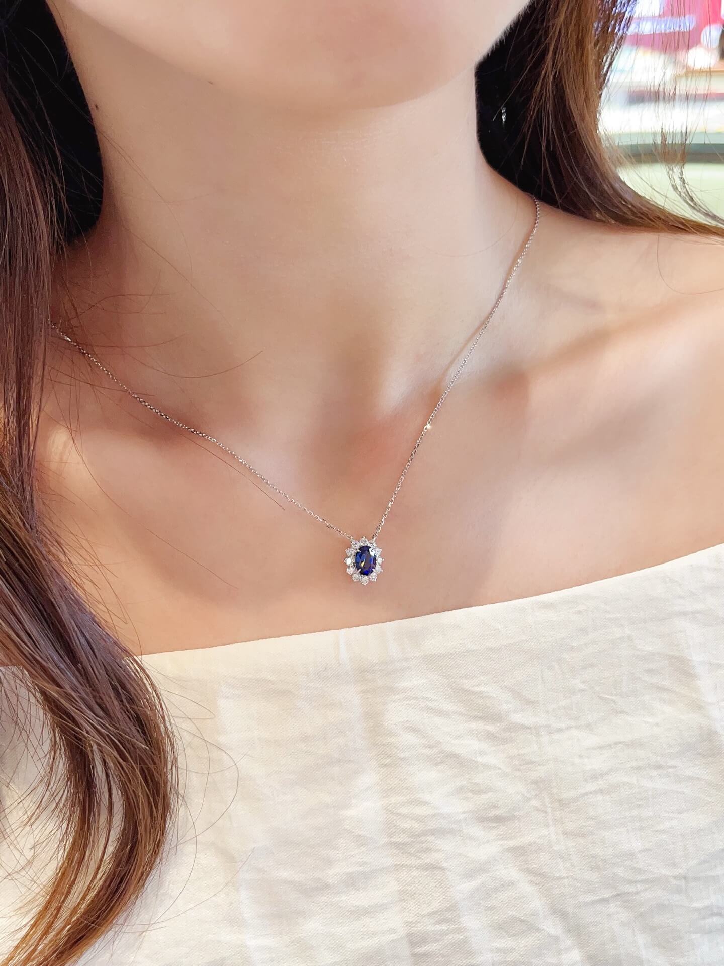 Halo setting oval cut lab grown sapphire pendant necklace