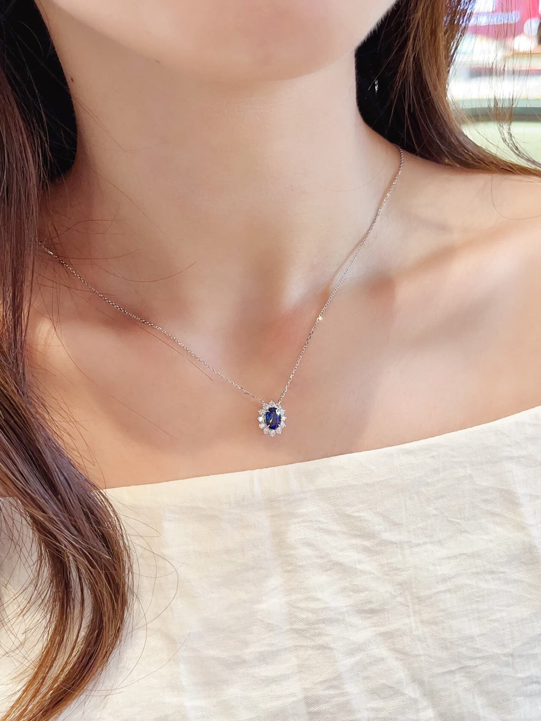 Halo setting oval cut lab grown sapphire pendant necklace