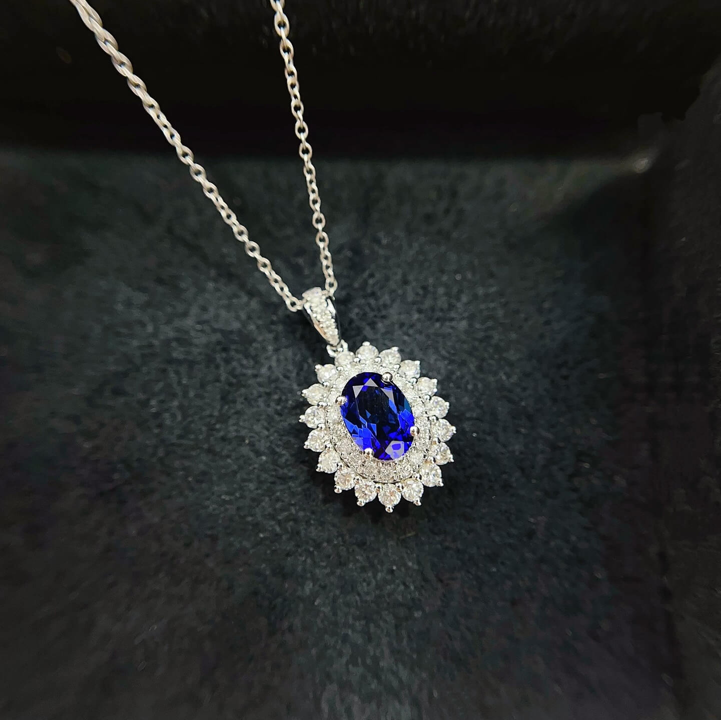 Halo setting oval cut lab grown sapphire pendant necklace