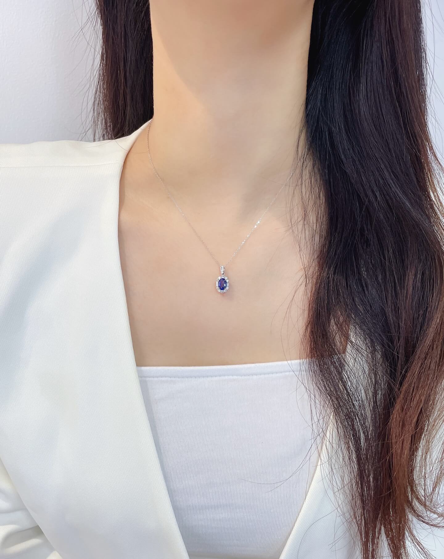 Halo setting oval cut lab grown sapphire pendant necklace