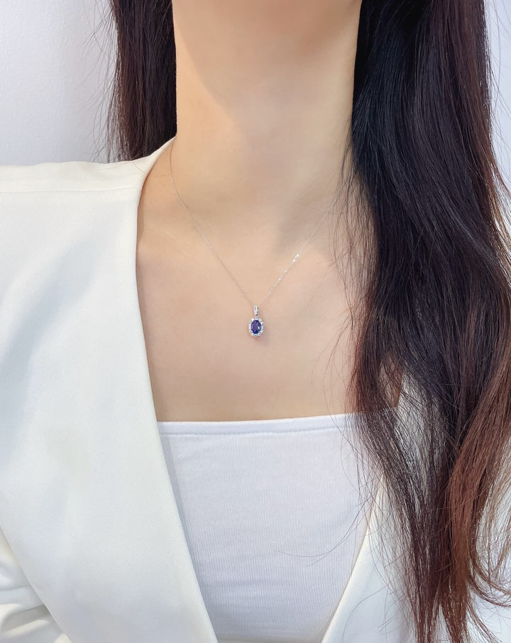 Halo setting oval cut lab grown sapphire pendant necklace