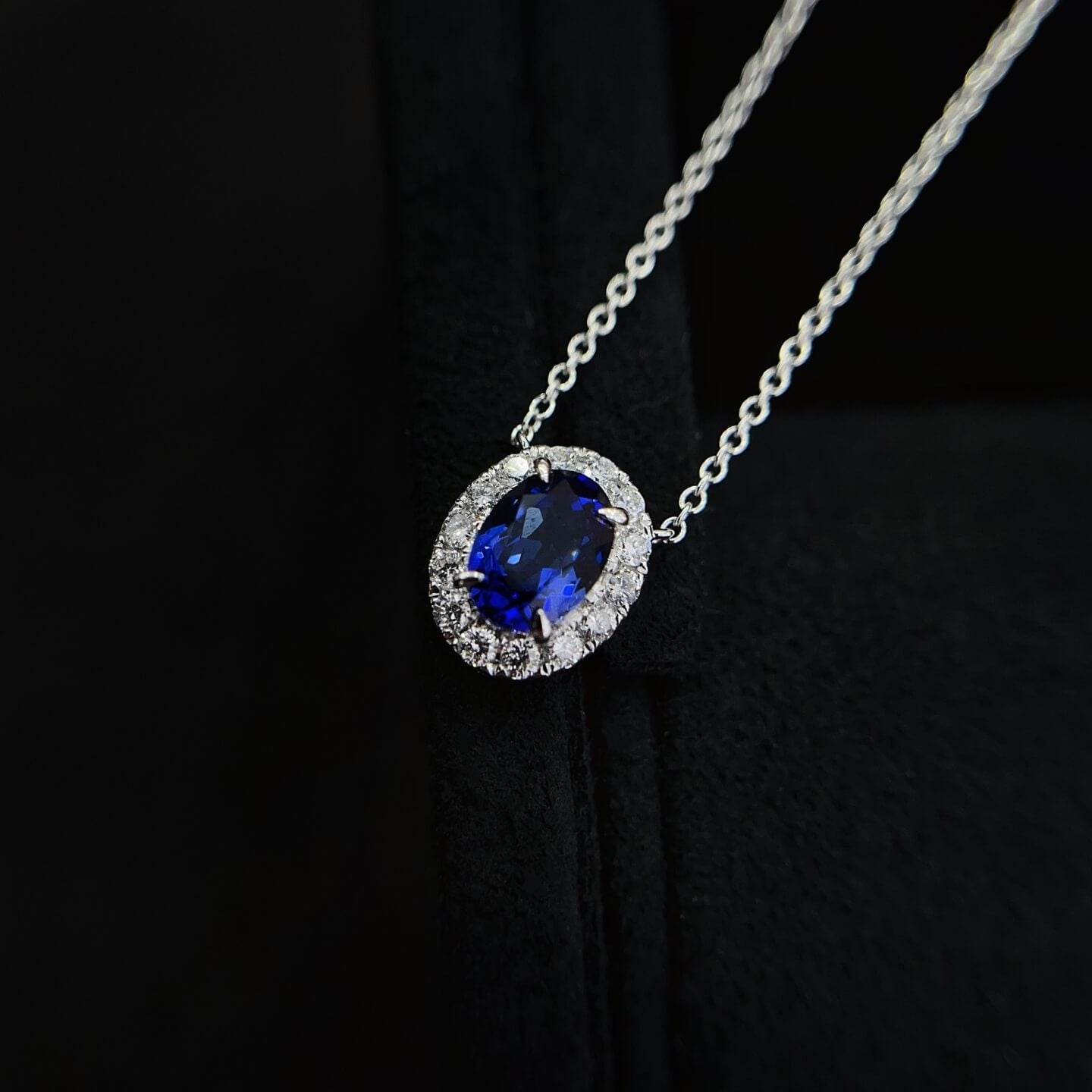 Halo setting oval cut lab grown sapphire pendant necklace
