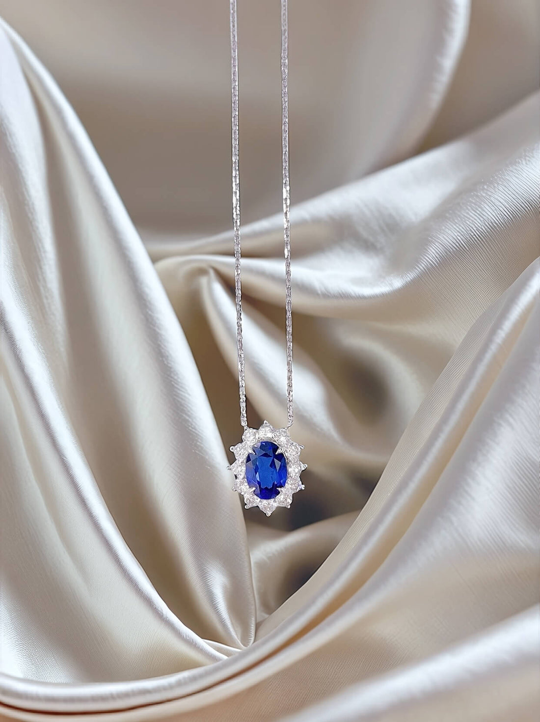 Halo setting oval cut lab grown sapphire pendant necklace