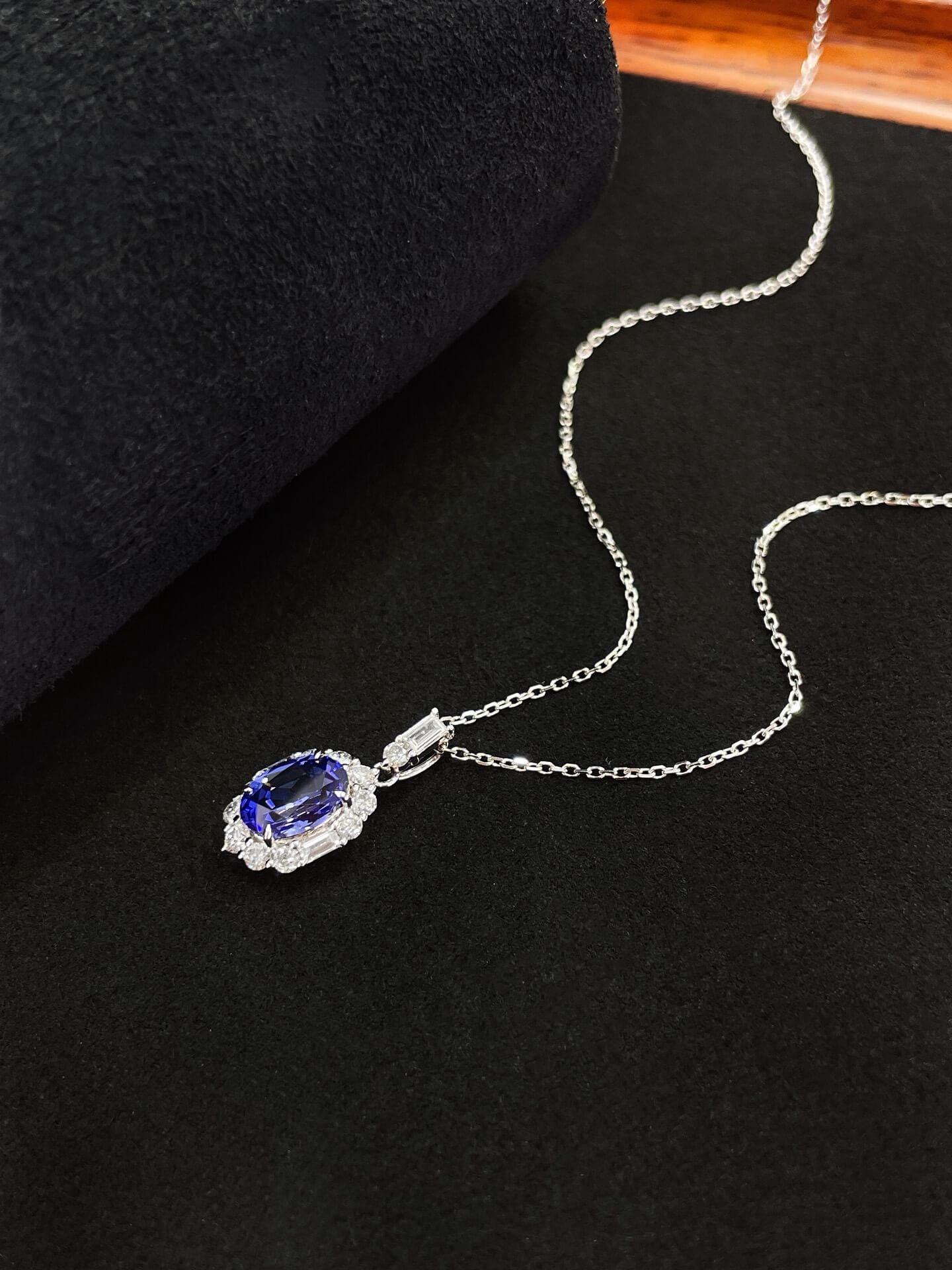 Halo setting oval cut lab grown sapphire pendant necklace