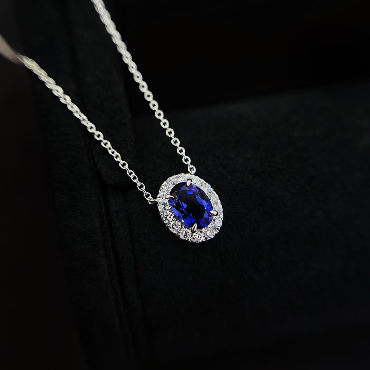 Halo setting oval cut lab grown sapphire pendant necklace