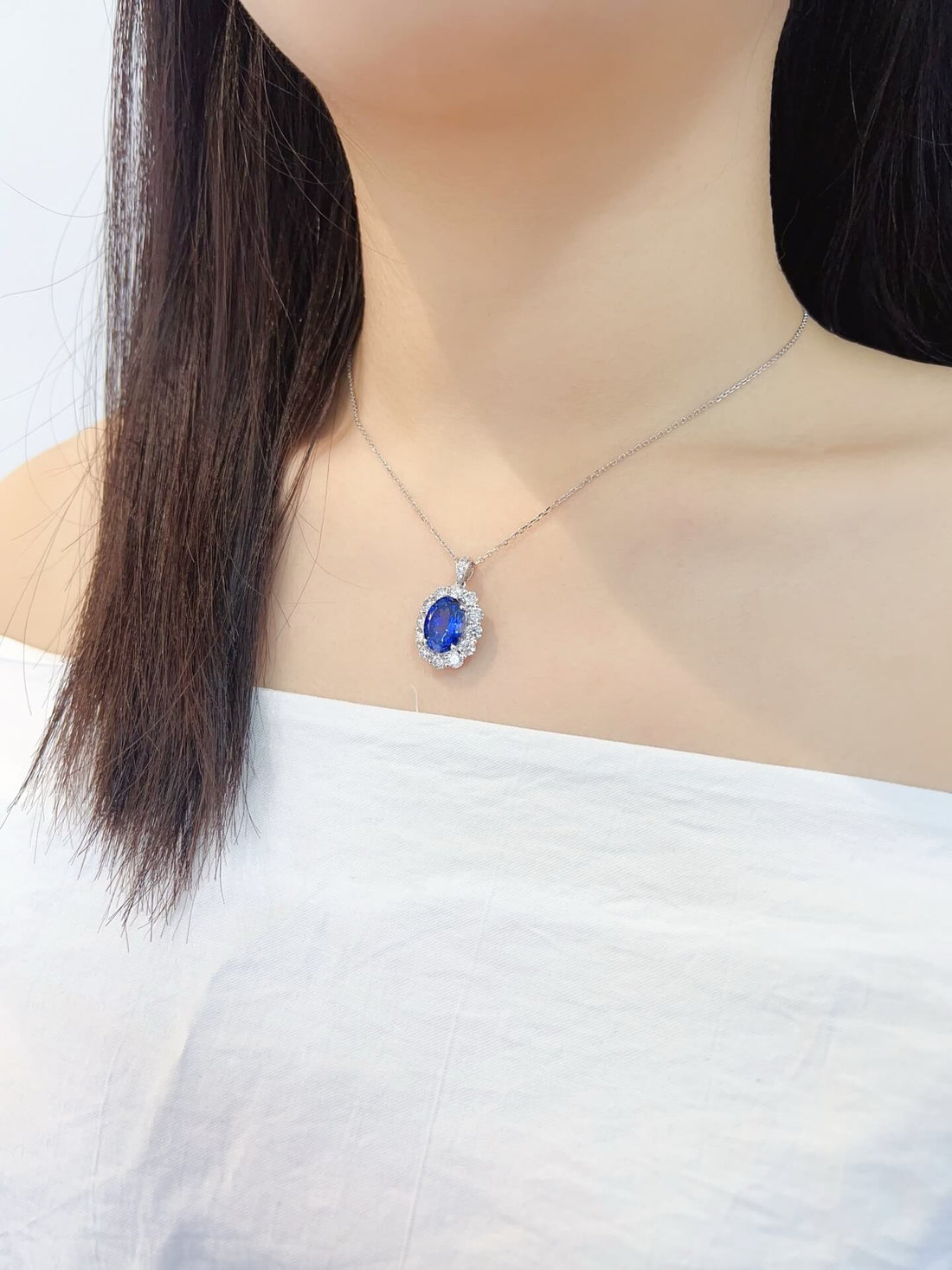 Halo setting oval cut lab grown sapphire pendant necklace