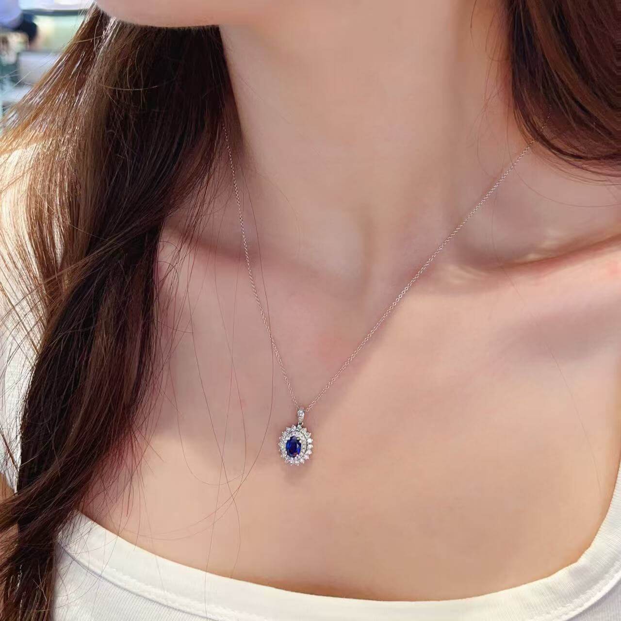 Halo setting oval cut lab grown sapphire pendant necklace