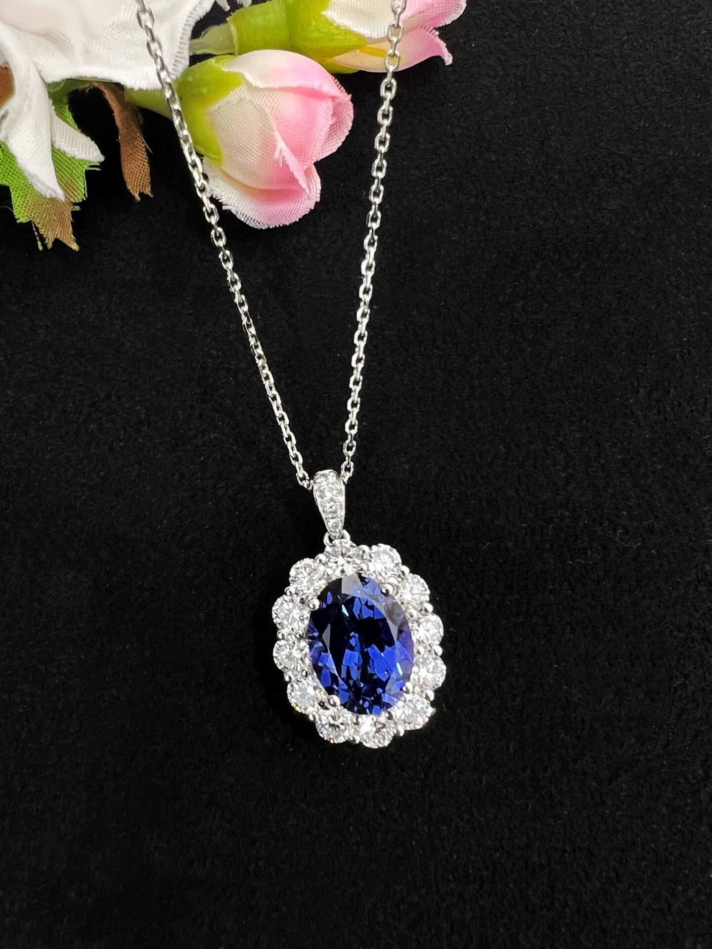 Halo setting oval cut lab grown sapphire pendant necklace