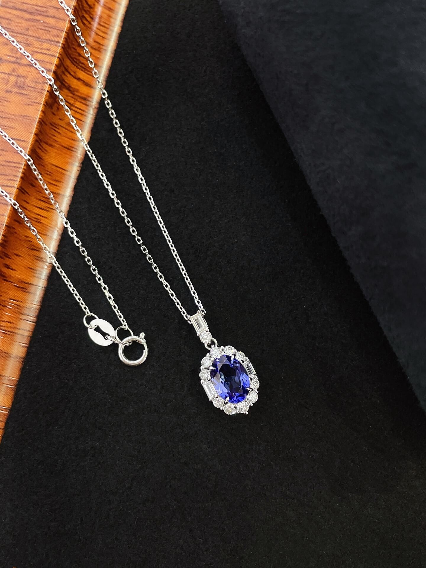 Halo setting oval cut lab grown sapphire pendant necklace