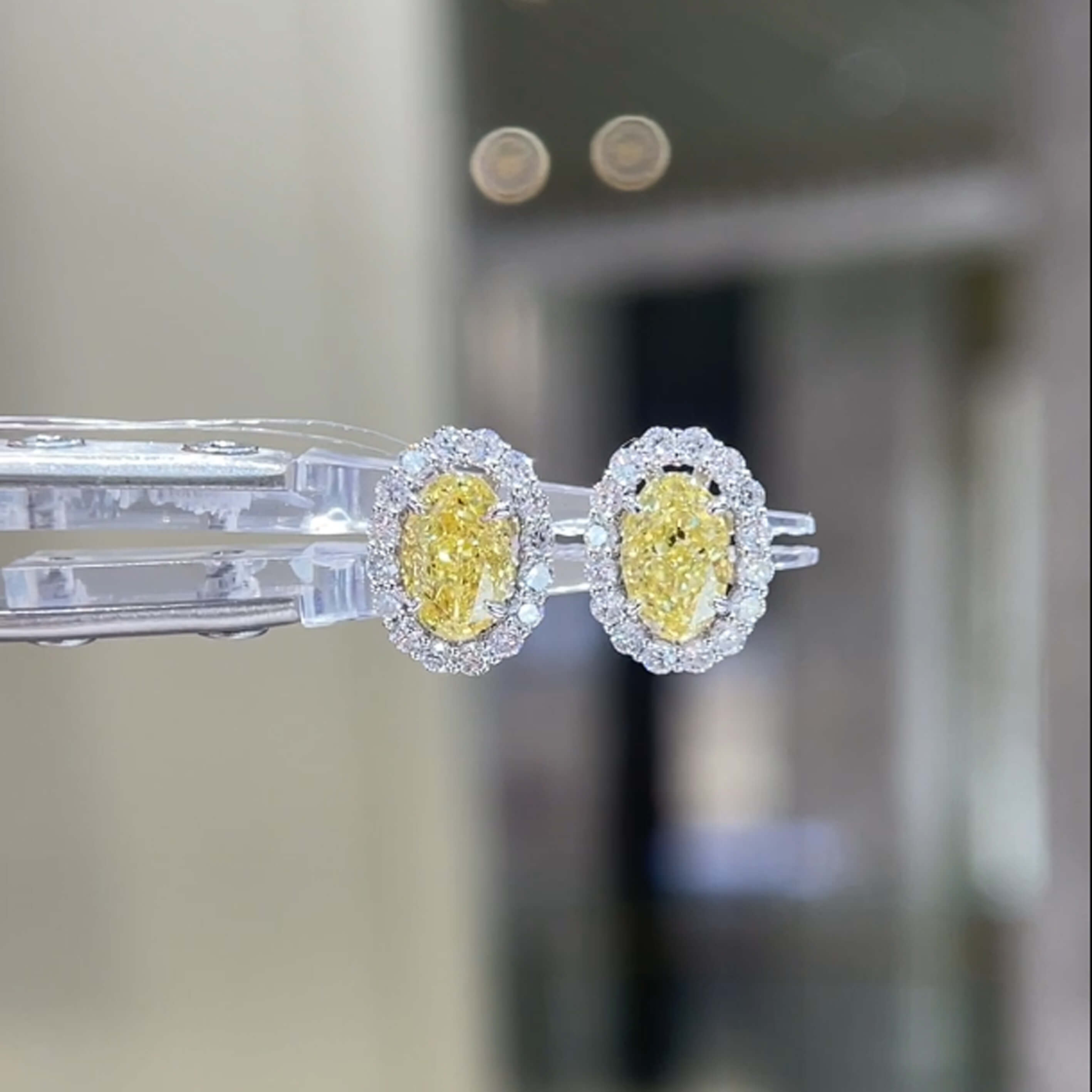 Halo setting oval cut lab grown yellow diamond earrings stud