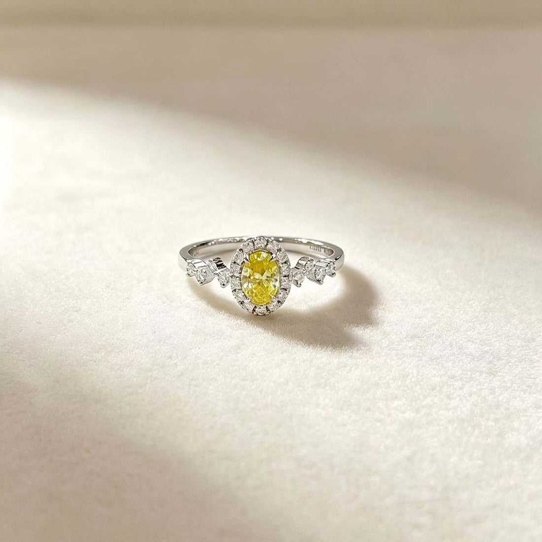 Halo setting oval cut lab grown yellow diamond engagement ring
