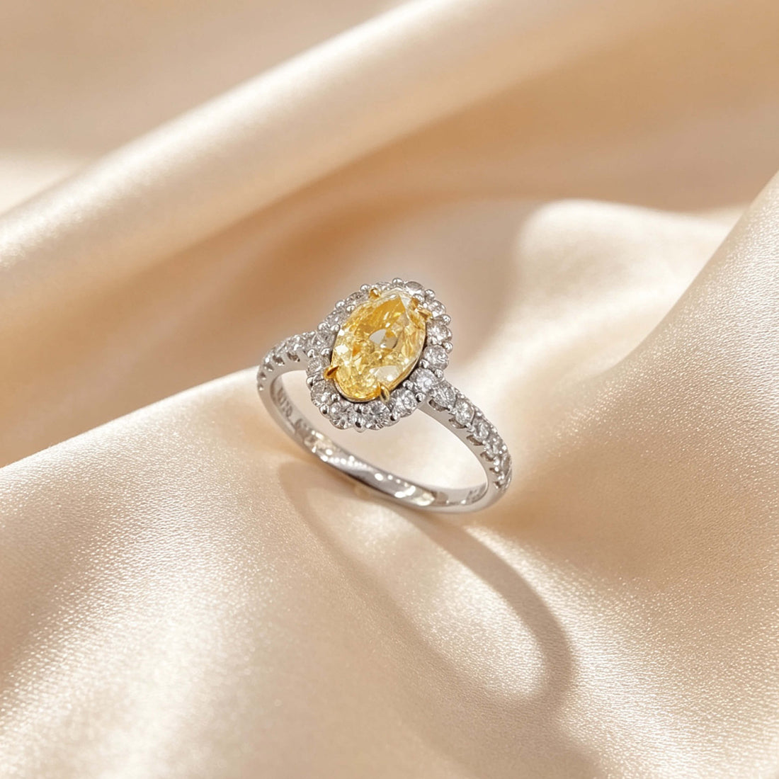 Halo setting oval cut lab grown yellow diamond engagement ring