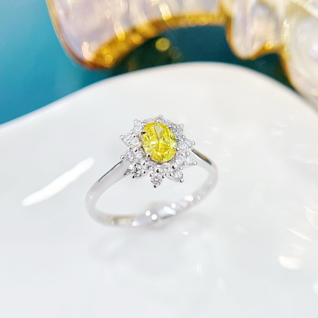 Halo setting oval cut lab grown yellow diamond engagement ring