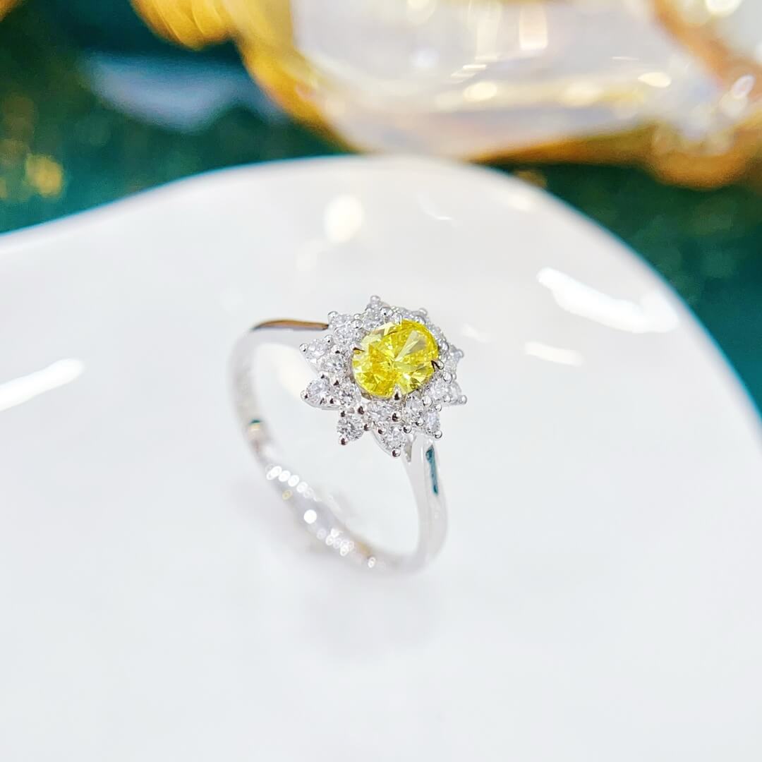 Halo setting oval cut lab grown yellow diamond engagement ring