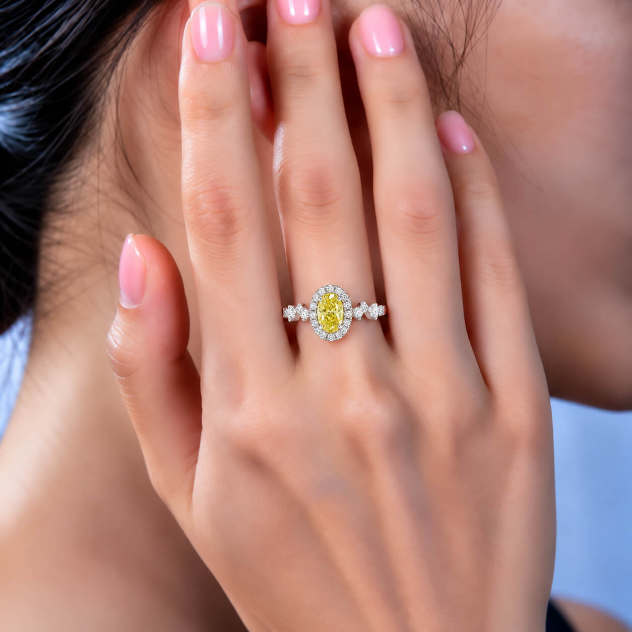 Halo setting oval cut lab grown yellow diamond engagement ring